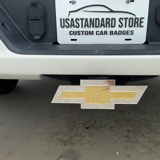 Chevrolet Bowtie hitch cover with gold center and silver outer finish