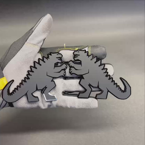 Godzilla inspired black acrylic car emblem with detailed dinosaur silhouette for cars, trucks, and SUVs.