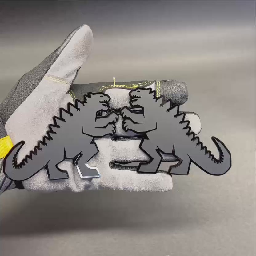 Godzilla inspired black acrylic car emblem with detailed dinosaur silhouette for cars, trucks, and SUVs.