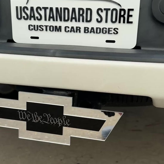 We the People Chevy Bowtie hitch cover mounted on rear truck receiver