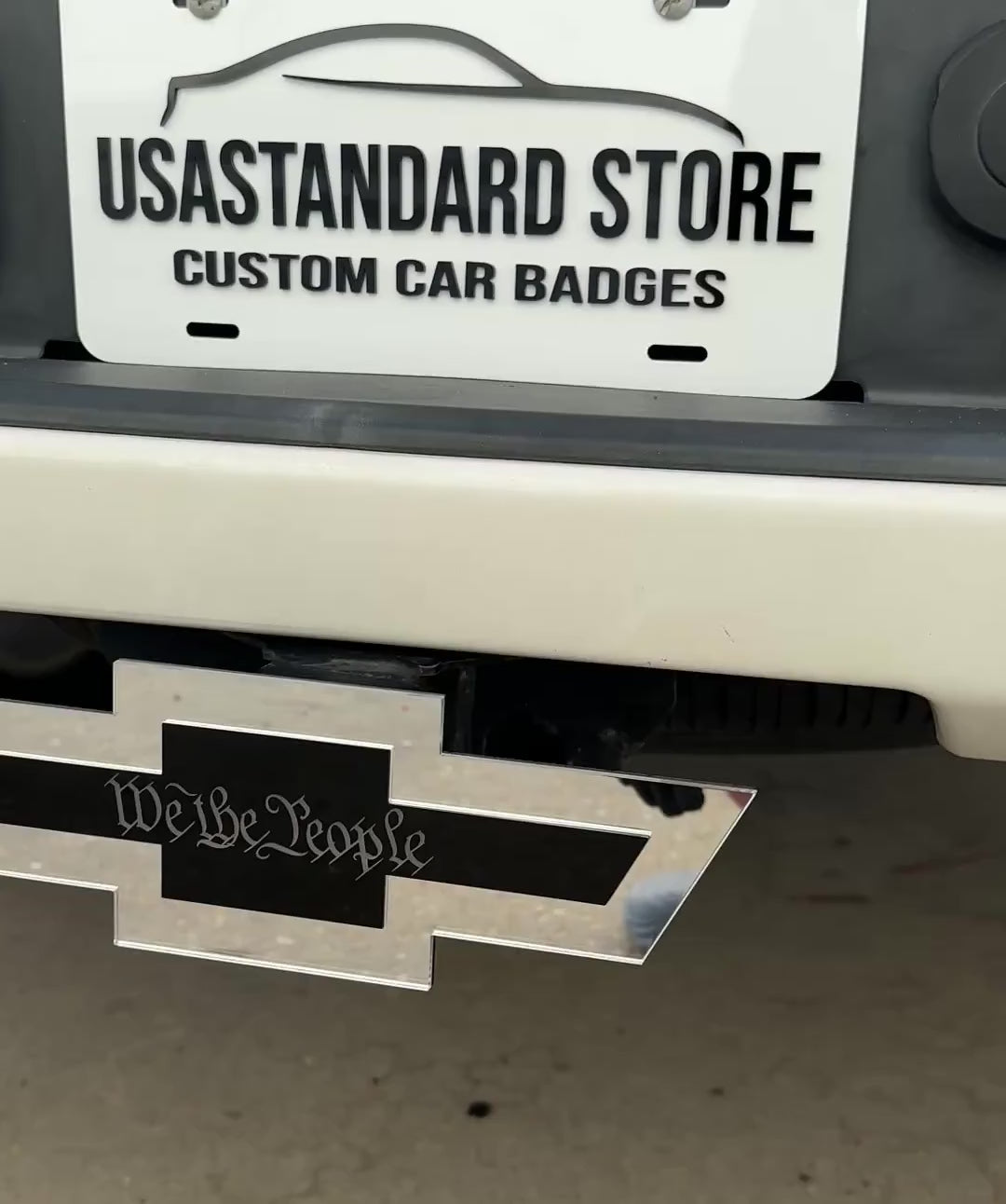 We the People Chevy Bowtie hitch cover mounted on rear truck receiver