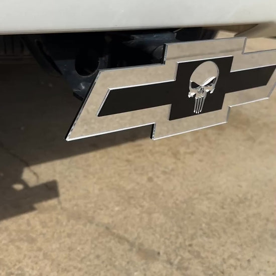 Chevrolet Bowtie hitch emblem with Punisher skull design in silver and blac