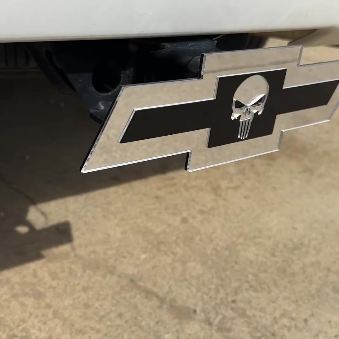 Chevrolet Bowtie hitch emblem with Punisher skull design in silver and blac