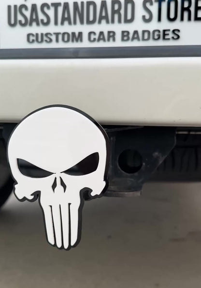 White and black Punisher skull hitch cover emblem mounted on truck receiver