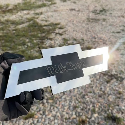 Chevrolet Bowtie hitch cover with silver finish and gold Autobot logo center