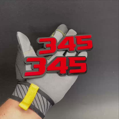 Red and black Fast 345 badge for car exterior styling