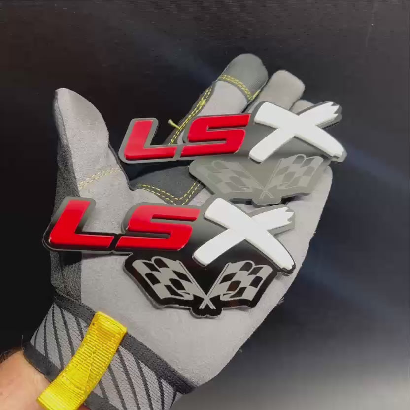 Red, white, and black LSX performance emblem with checkered racing flags