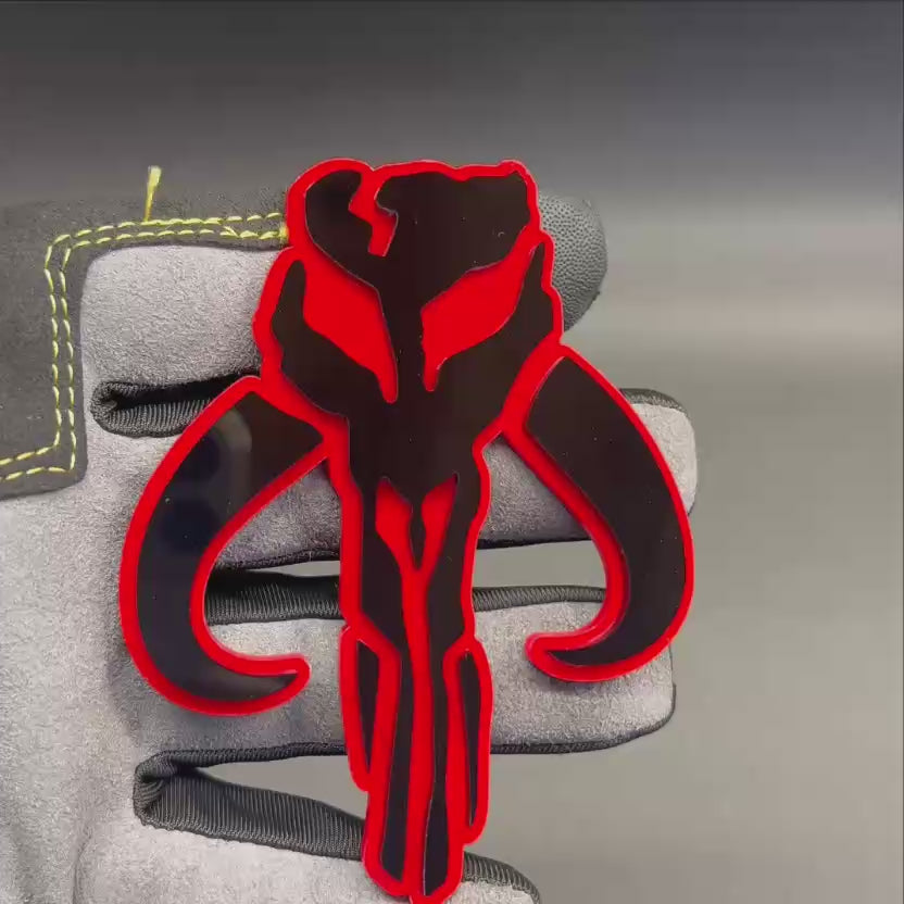 Mythosaur skull car emblem in black with red outline