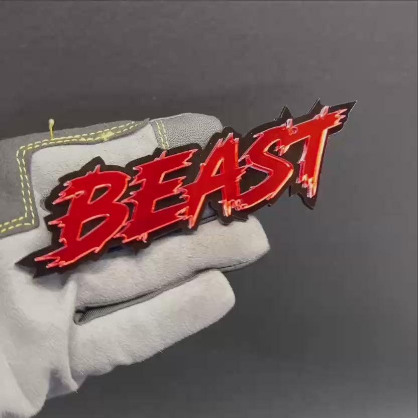 Red and black BEAST text car badge for fender or tailgate installation
