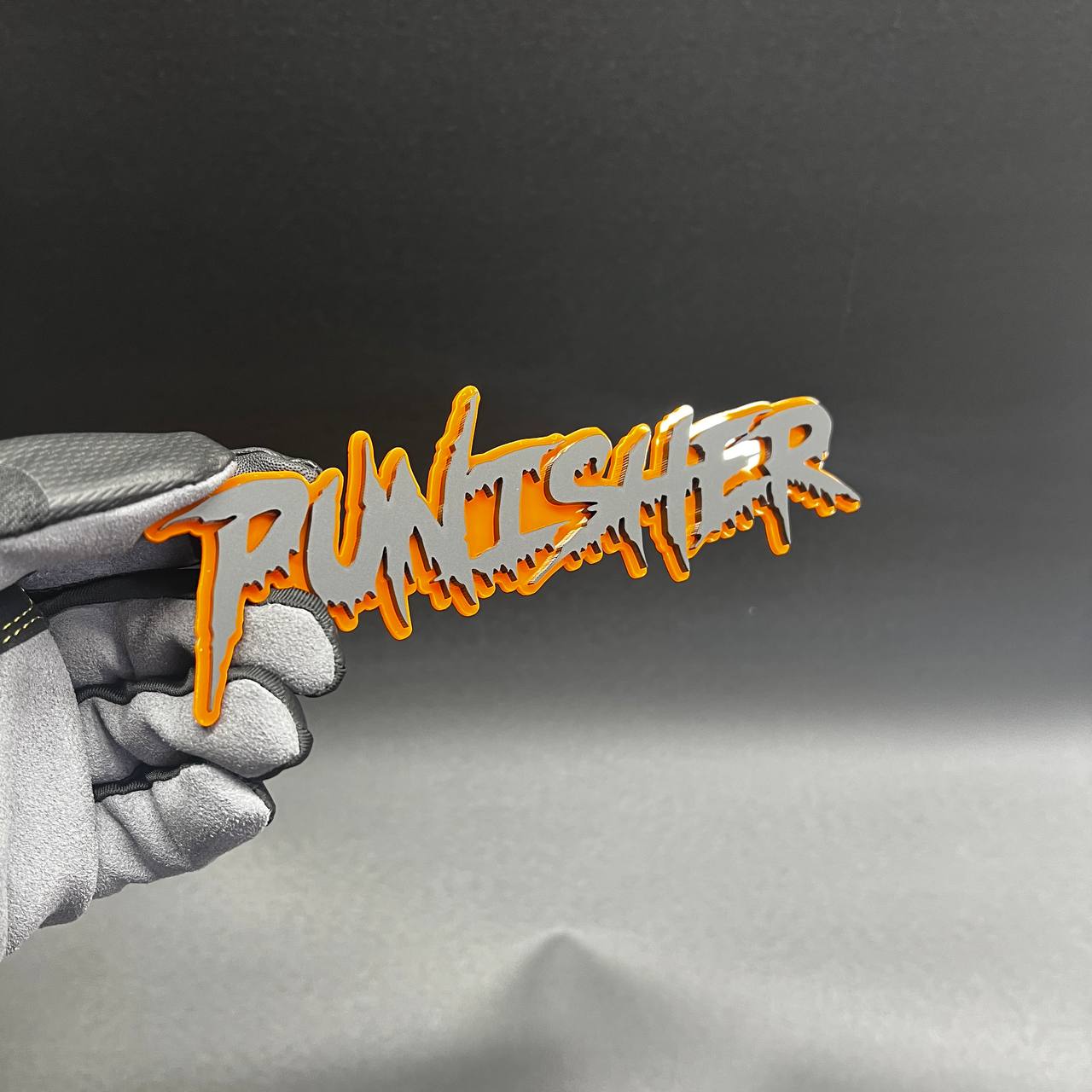 Handmade Punisher text emblem with bold jagged letters and automotive adhesive backing