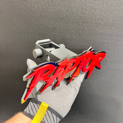 Decorative RAPTOR text emblem for a 2-inch vehicle hitch receiver