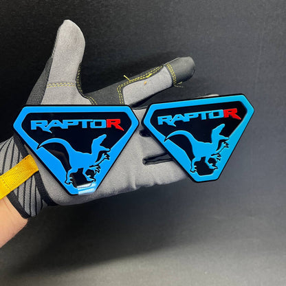 Two-piece blue Raptor shield Car Badge Fender Emblem set with dinosaur silhouette for F-150 Raptor inspired exterior trim.