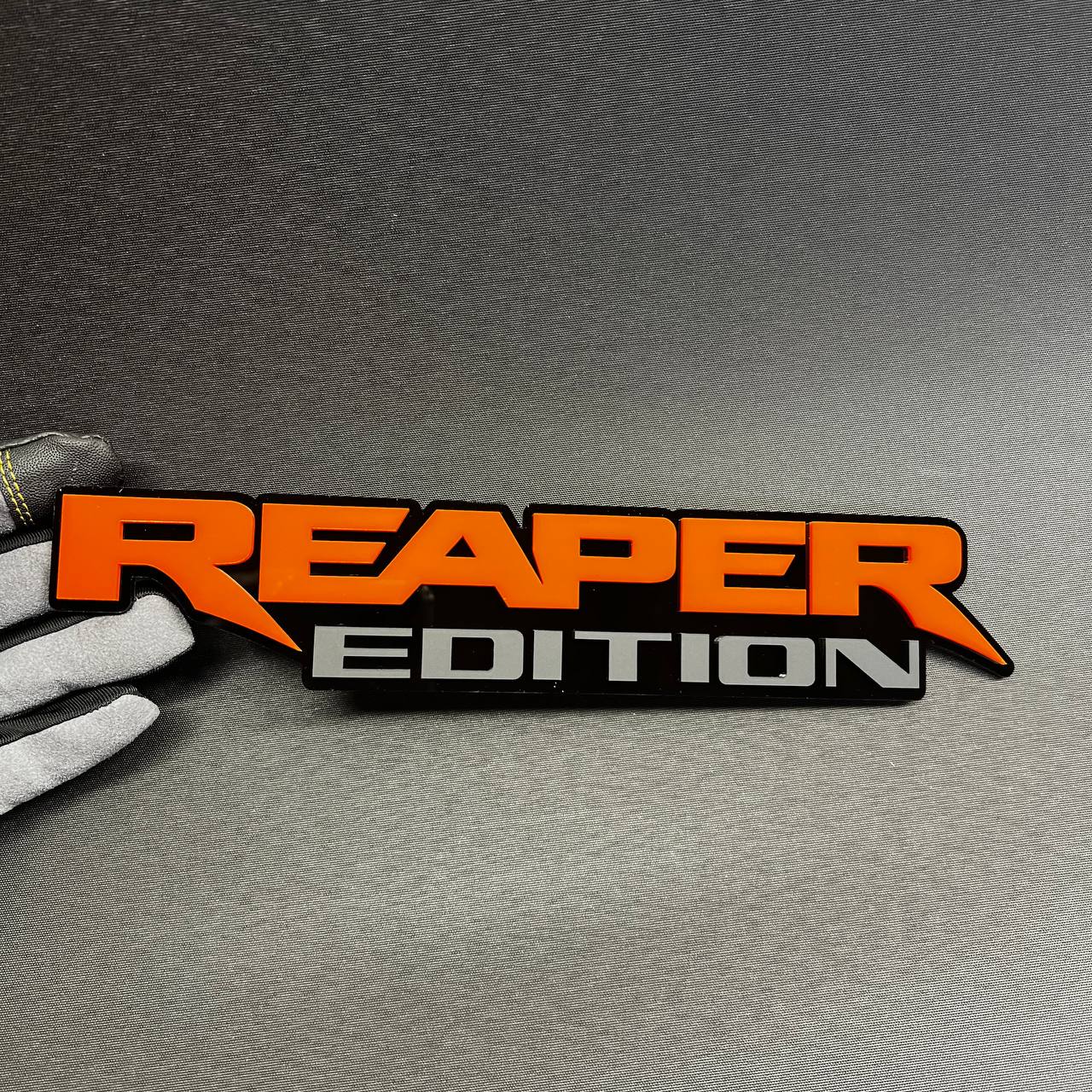 Reaper Edition Car Badge Fender Emblem in orange and gray with black base
