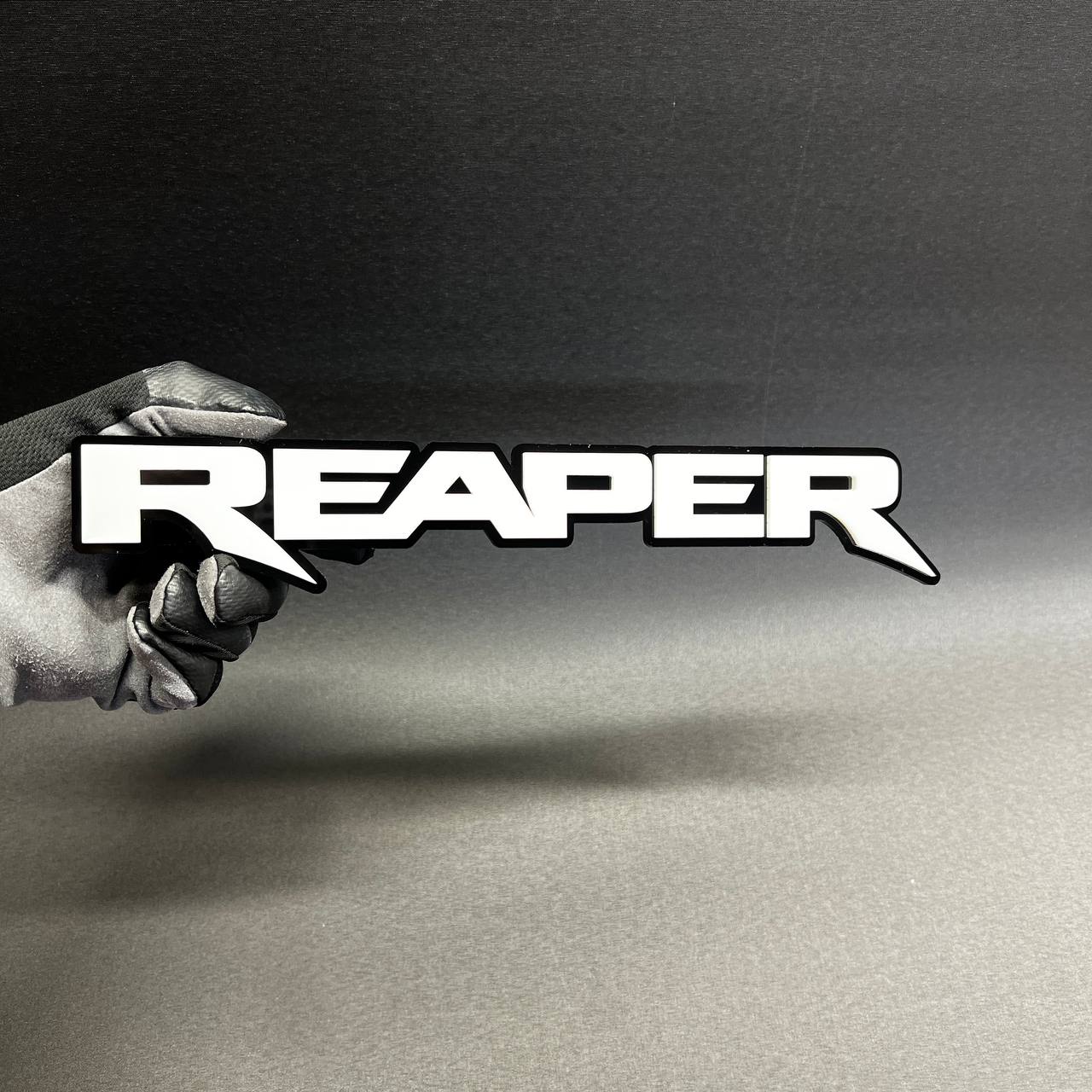 Custom Reaper text badge in bold racing font for muscle truck appearance