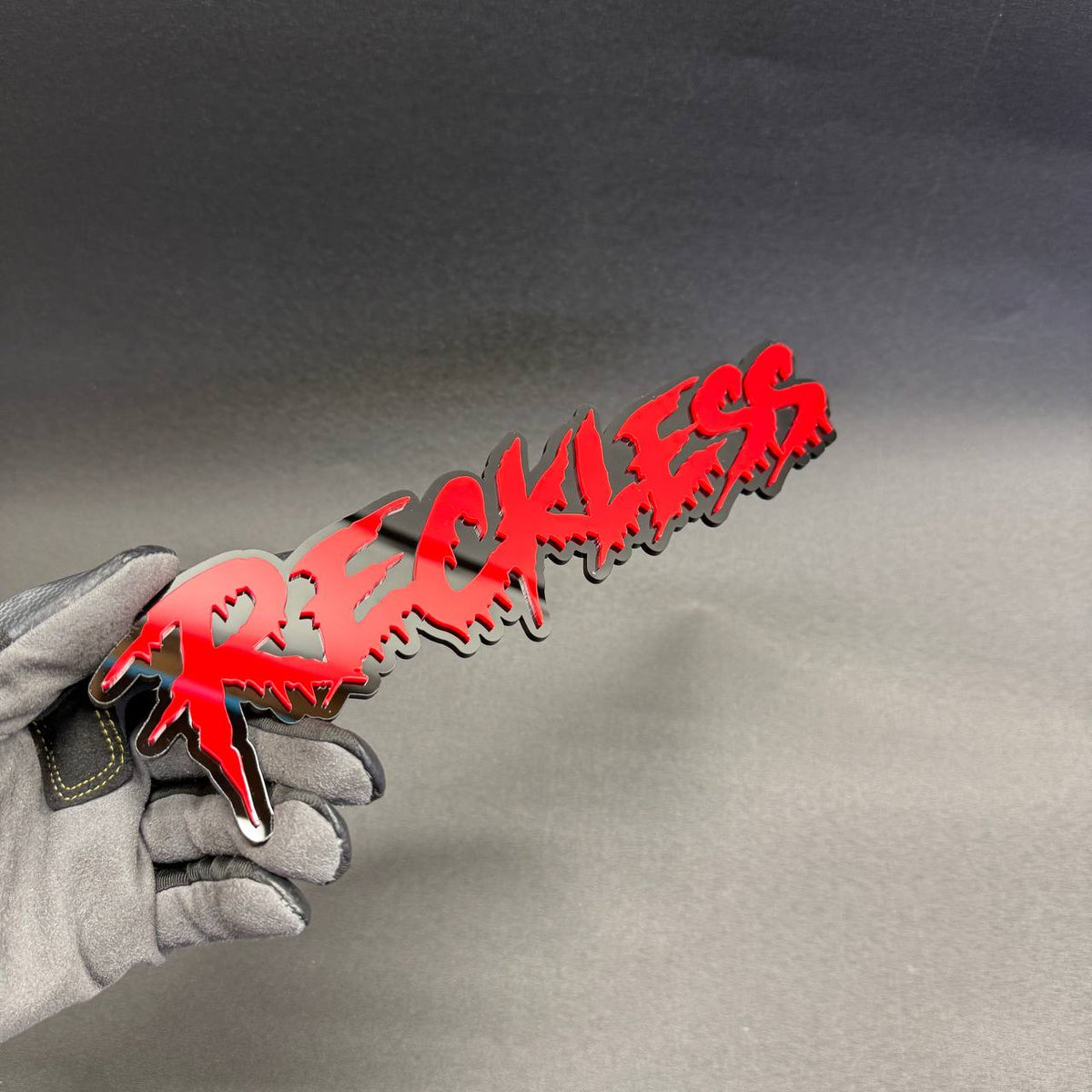 Reckless custom aftermarket text car badge in blood red and black for Dodge Challenger SRT Hellcat Charger Scat Pack.