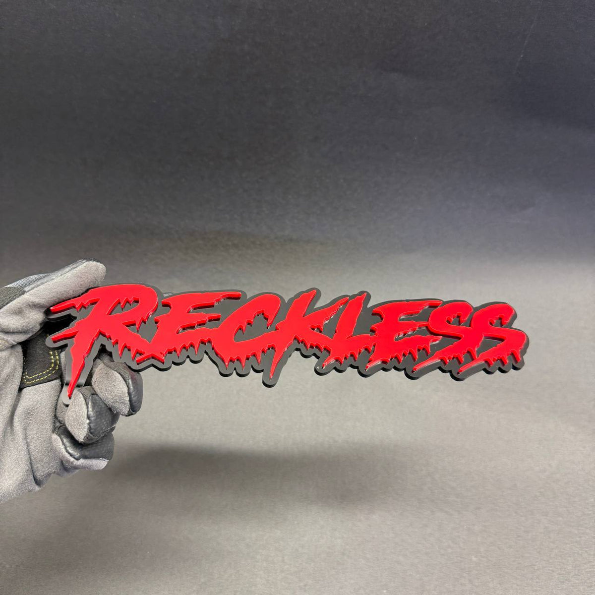 Reckless red and black dripping graffiti text car badge fender emblem for Dodge Charger Challenger muscle car styling.