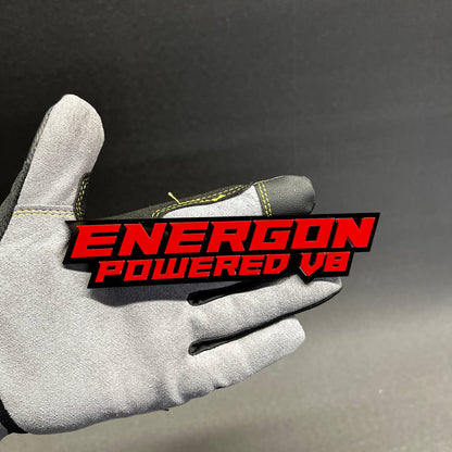 Handmade automotive acrylic emblem with bold red lettering and black backing layer.