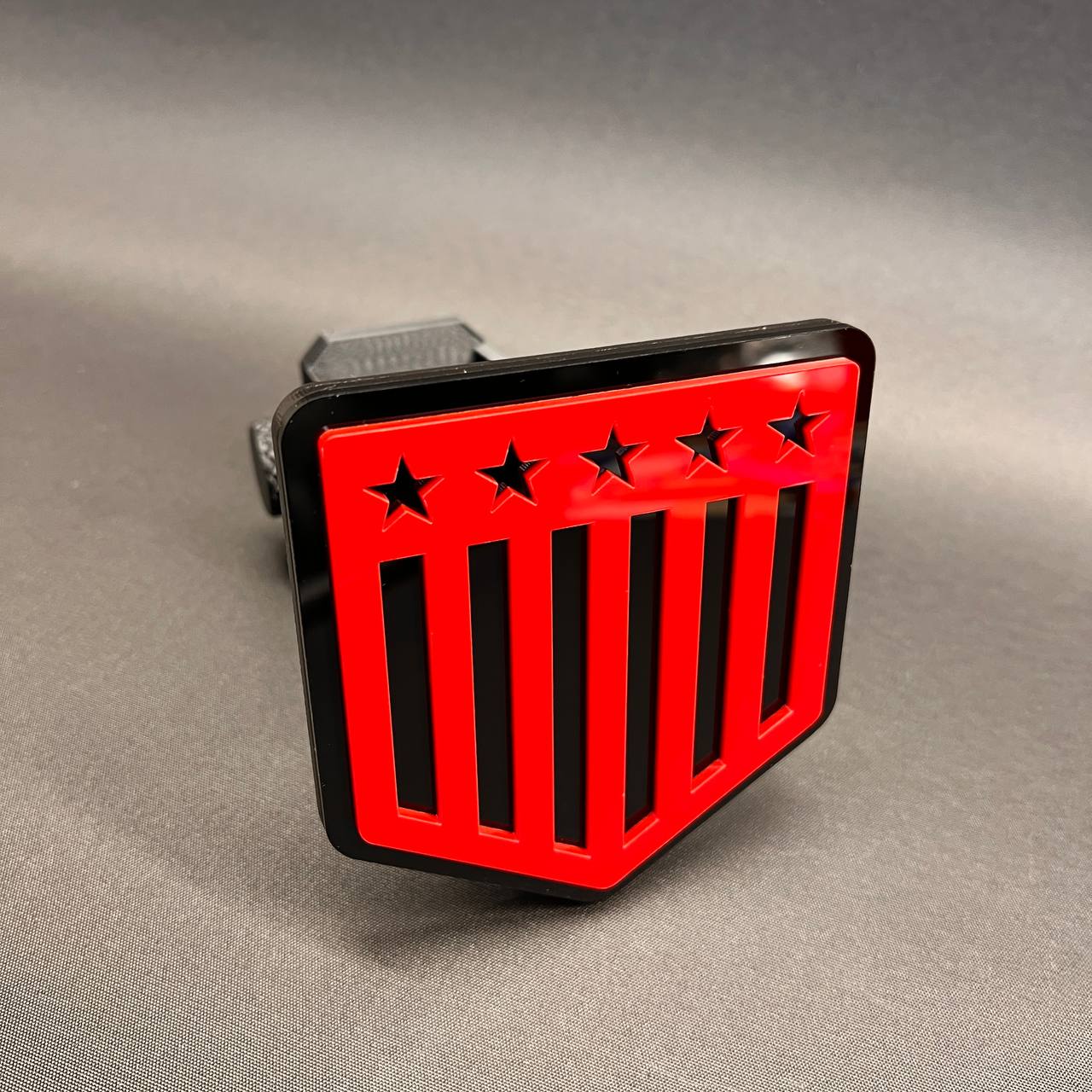 American flag receiver hitch plug cover with red stars and stripes