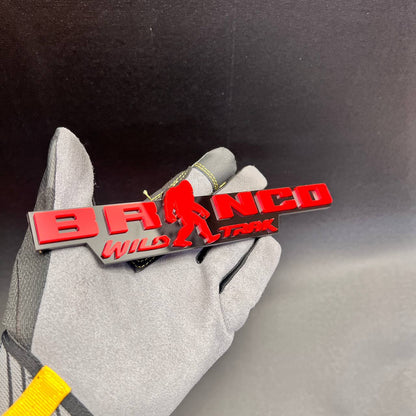 Custom Bronco Wild Trak badge featuring a red Sasquatch silhouette