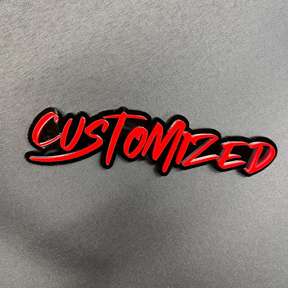 Custom graffiti font car badge with red lettering and black base