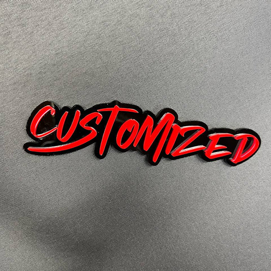 Custom graffiti font car badge with red lettering and black base