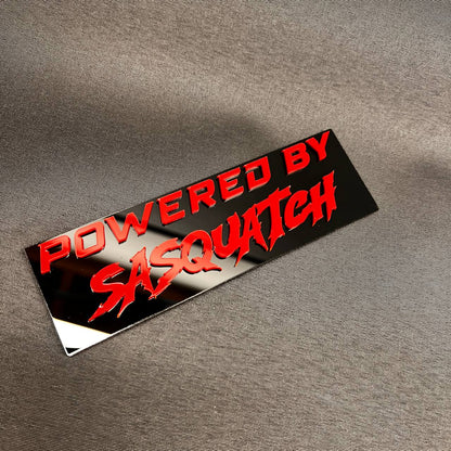 Sasquatch themed car badge fender emblem in red and black design