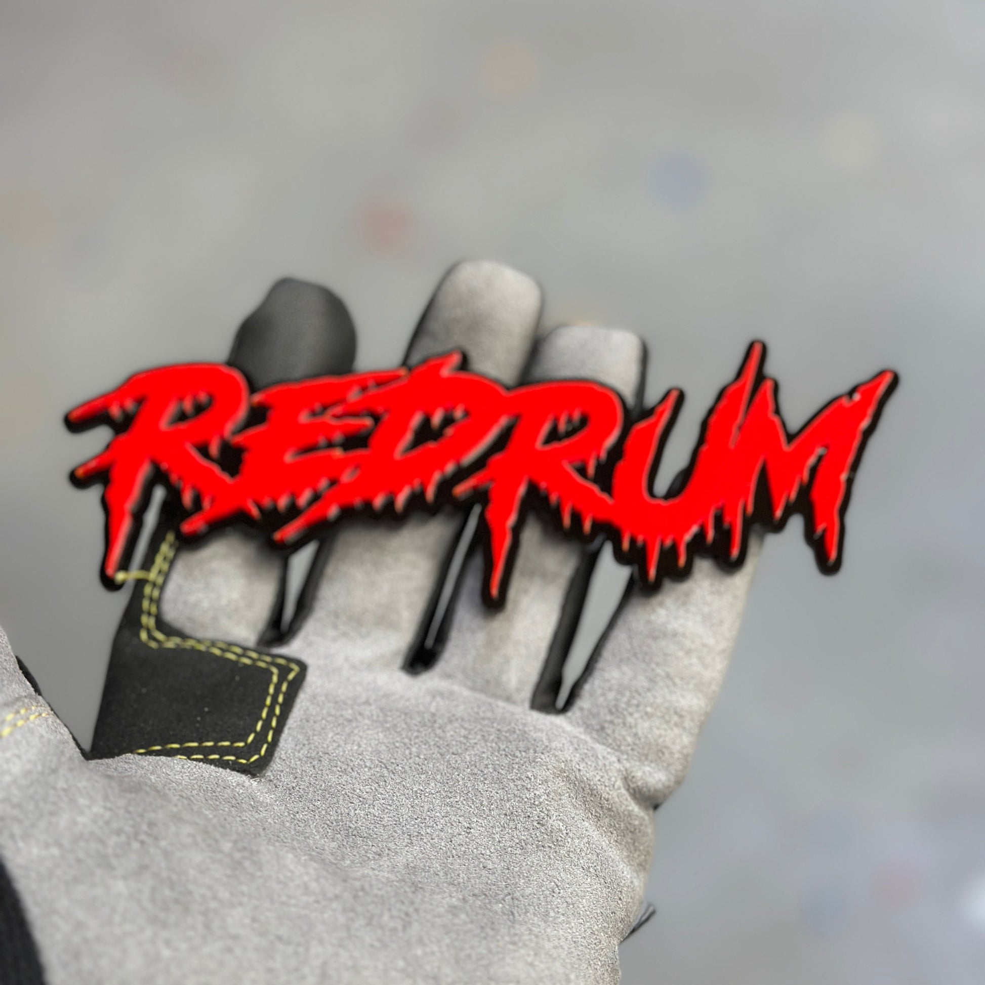 Red and black Red Rum exterior car badge fender emblem close up