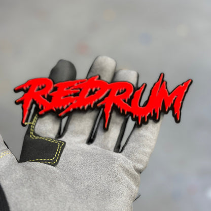 Red and black Red Rum exterior car badge fender emblem close up
