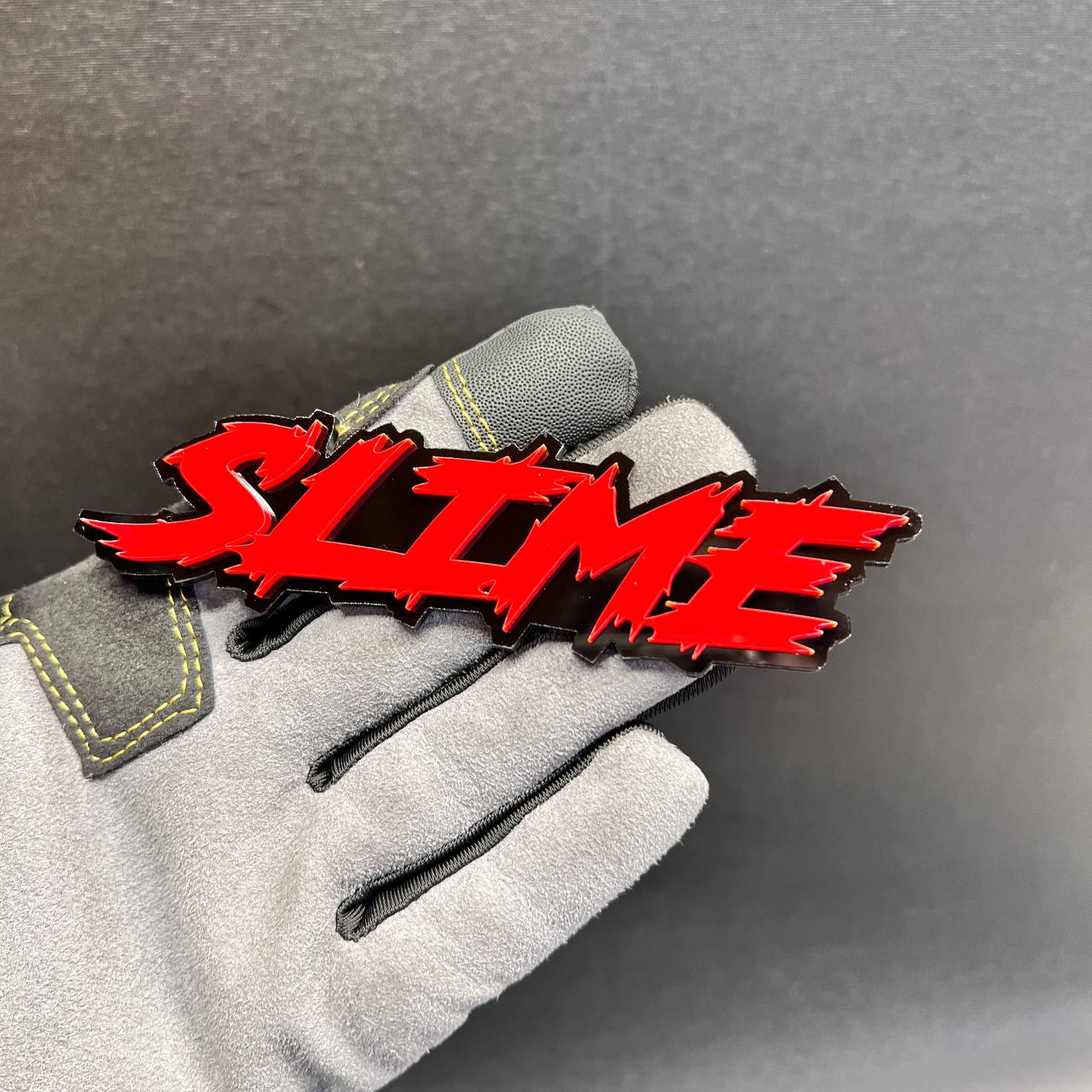 Layered SLIME vehicle text badge with bold horror-style lettering