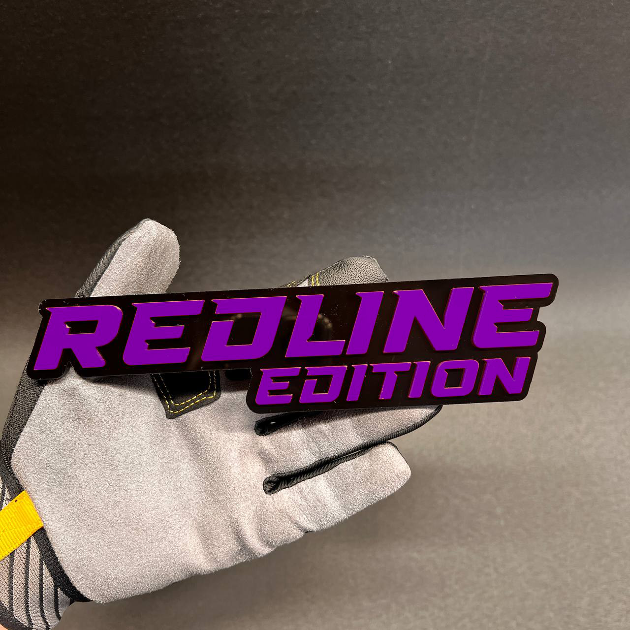 Custom Redline Edition automotive badge with raised red lettering