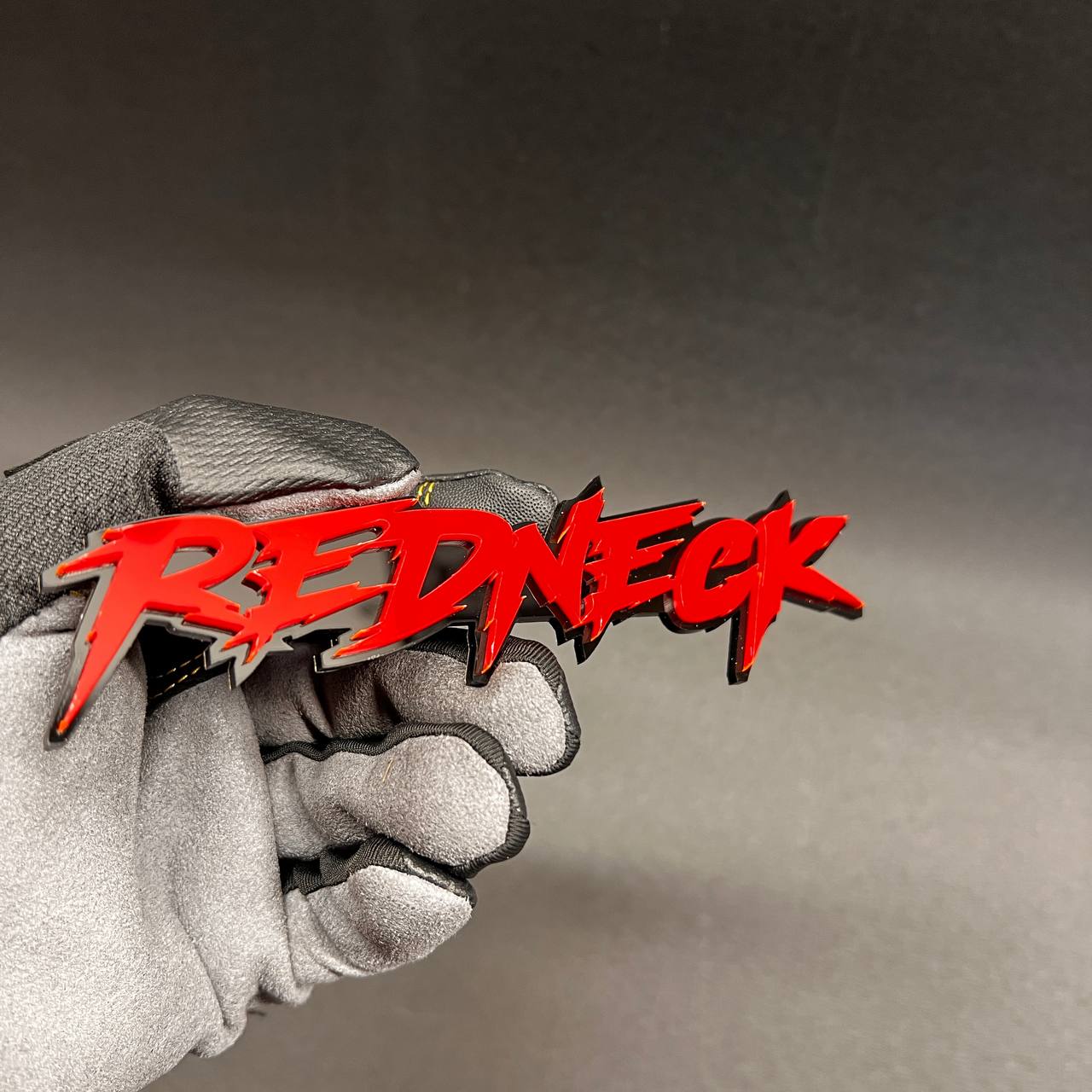 Redneck custom car emblem made for exterior vehicle customization.