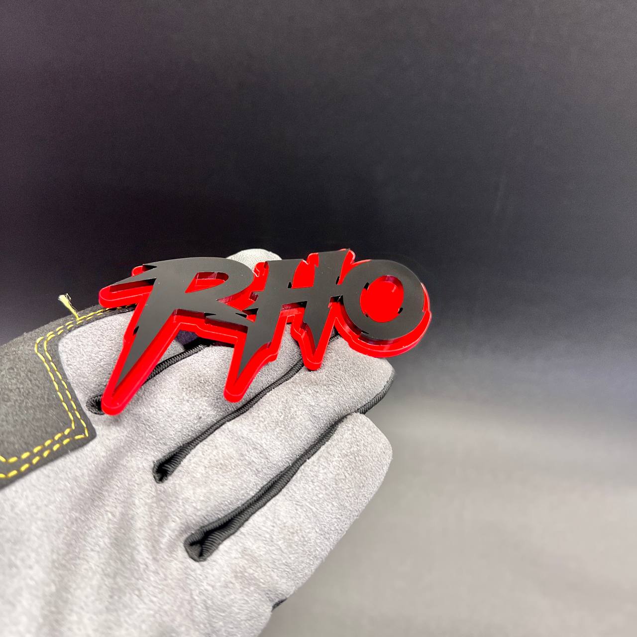 Custom RHINO vehicle badge with aggressive red and black automotive design