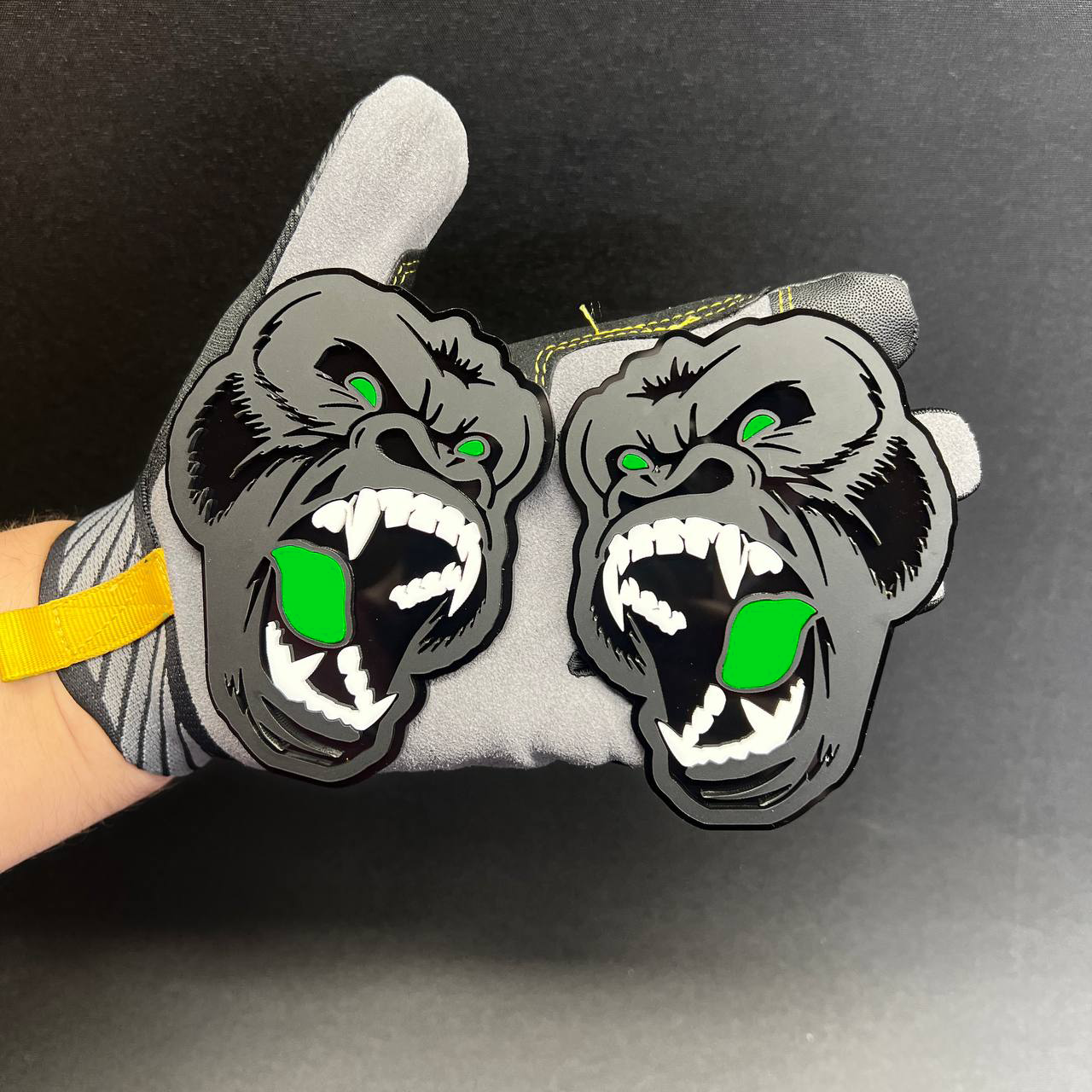 Angry ape Car Badge Fender Emblem in gray and black with pink mouth and eye details.