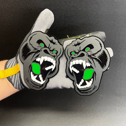 Angry ape Car Badge Fender Emblem in gray and black with pink mouth and eye details.