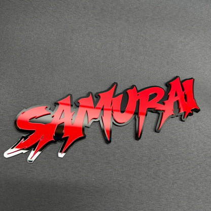 Red and black SAMURAI custom car emblem text badge for Subaru, Mazda, Mitsubishi, Nissan and Honda vehicles