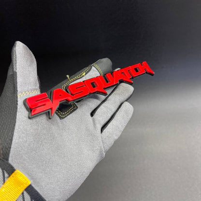 Custom Sasquatch 3D car badge with red lettering and black base