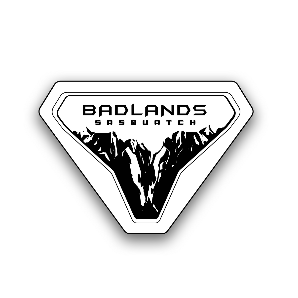 Badlands Sasquatch off-road vehicle badge with engraved mountain graphic