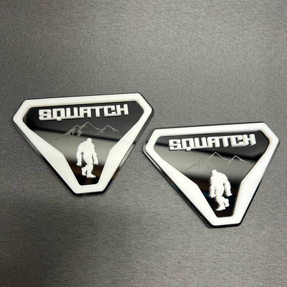 Sasquatch off road car badge with white border and black background