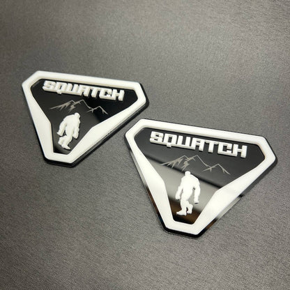 White on black Sasquatch 4x4 style car badge emblem