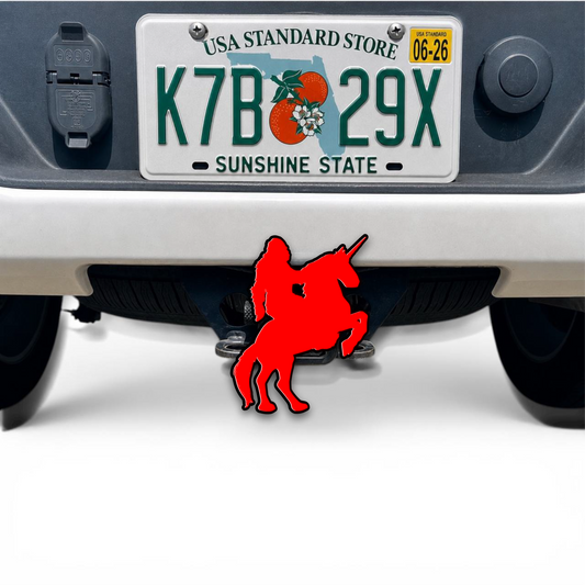 Red Sasquatch on horse 3D hitch cover mounted on truck receiver, custom trailer hitch accessory with black outline