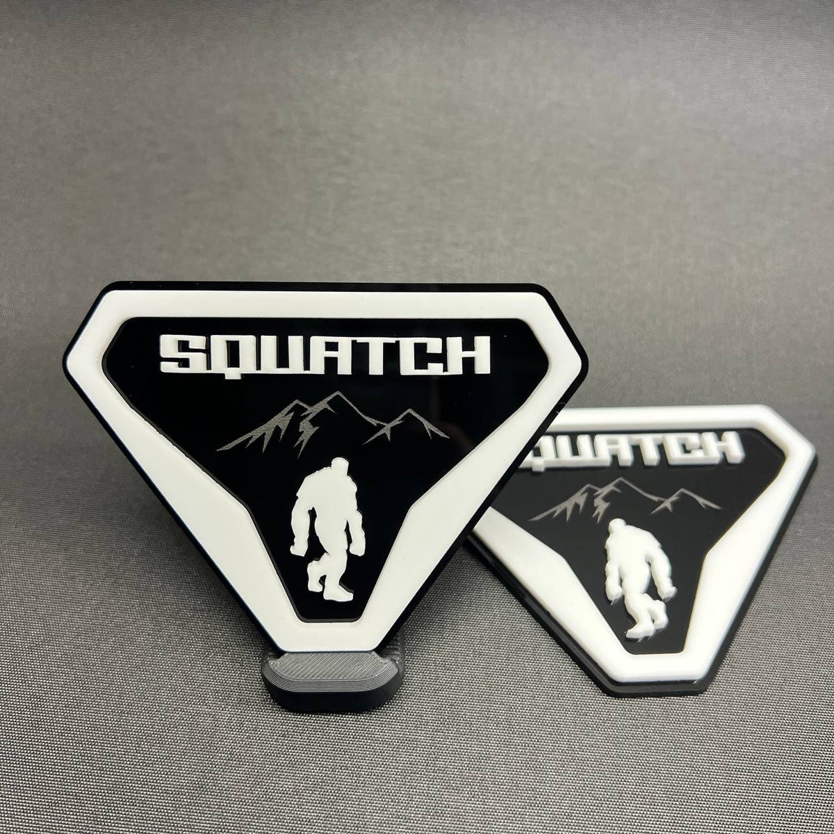 Sasquatch white on black car badge emblem with mountain design