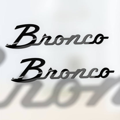 Script-style black acrylic emblem badge installed on SUV panel, compatible with Ford Bronco