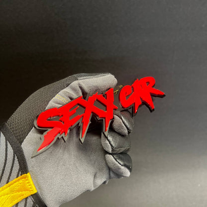 Acrylic sexy text emblem mounted with automotive adhesive backing