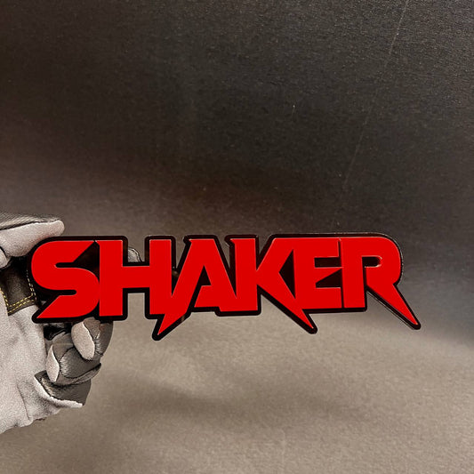 SHAKER custom red and black 3D car badge for vehicle exterior.
