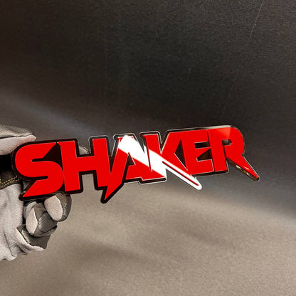 SHAKER acrylic-style custom emblem with automotive 3M adhesive backing.