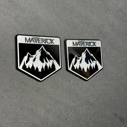 Brushed silver and black Maverick  badge with mountain design