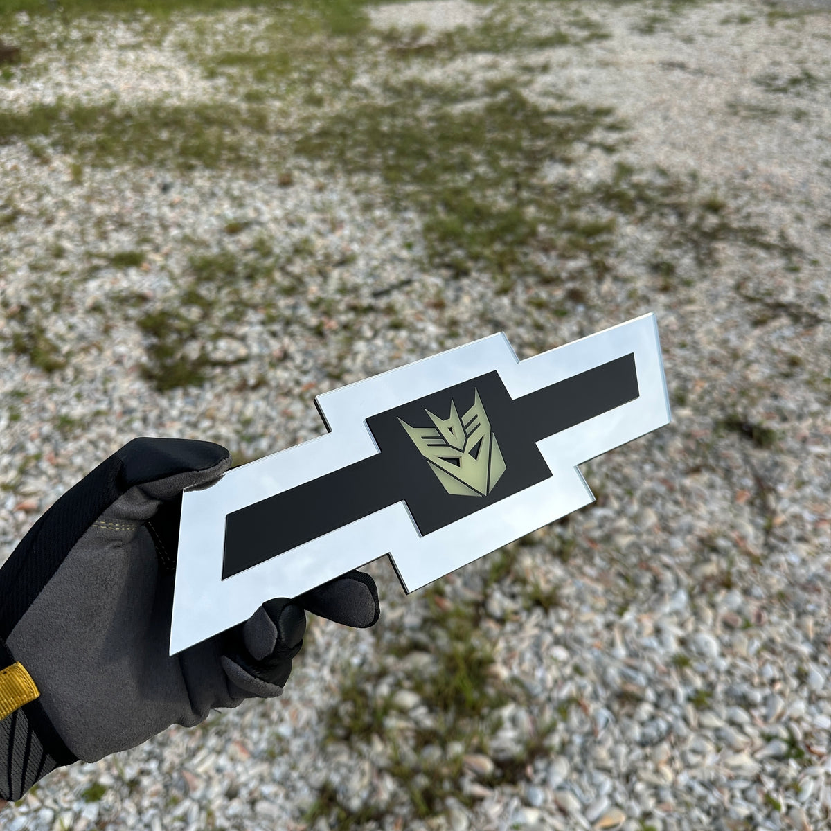 Chevrolet Bowtie silver emblem with centered glow Decepticon graphic