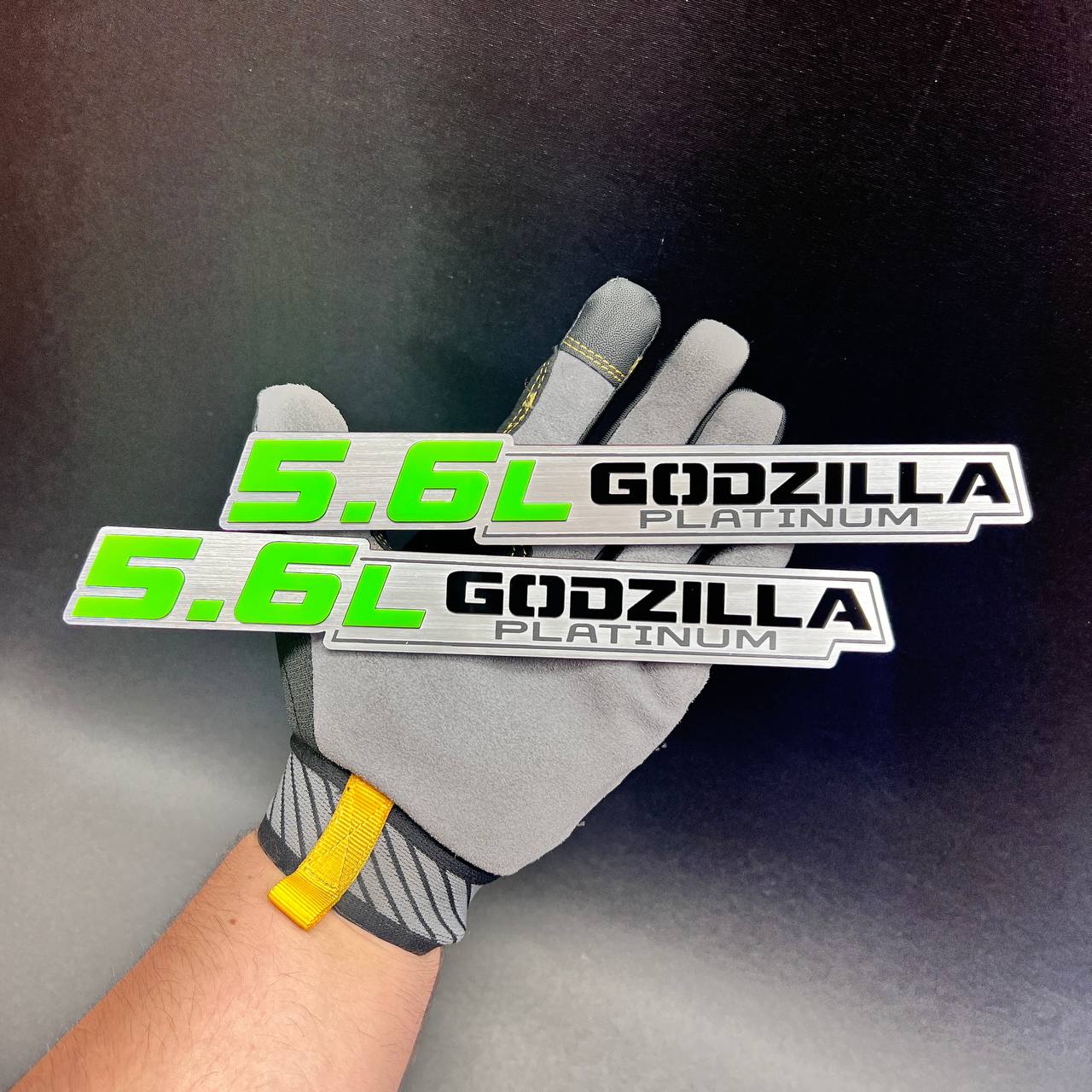 Brushed silver 5.6L Godzilla Platinum car emblem with vivid green engine lettering