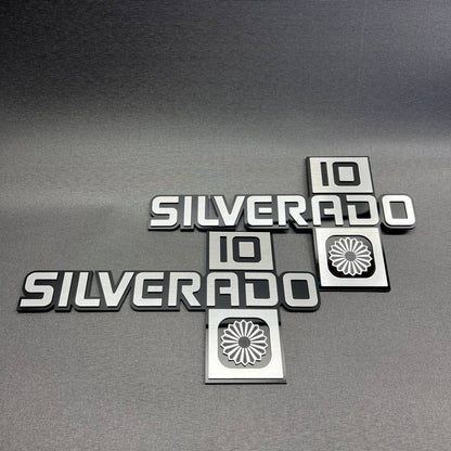 Black and silver Silverado 10 car emblem set