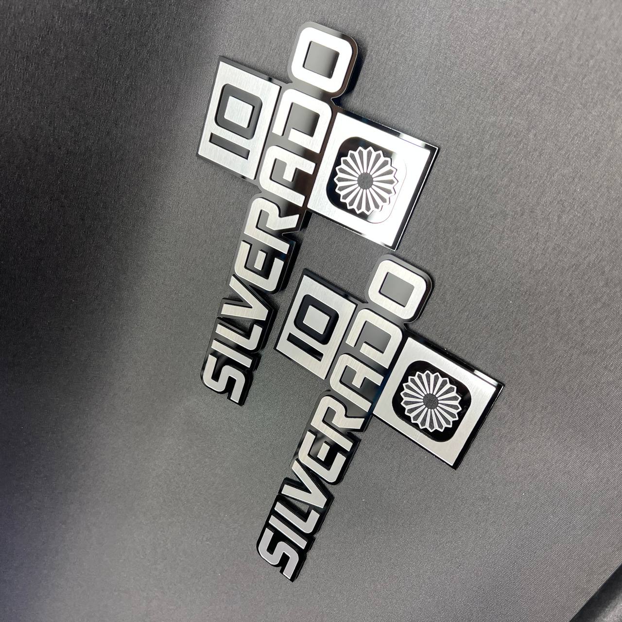 Brushed silver Silverado 10 badge with black background